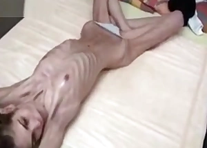 Freakish skinny half-starved babe posing in her panties exhibitionism