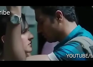 Indian boy and girl kissing in the morning mumbai local train first time