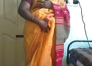 Desi indian horny tamil telugu kannada malayalam hindi slutty wife vanitha crippling orange colour saree showing big boobs and hairless fur pie press hard boobs press nip rubbing fur pie calumny